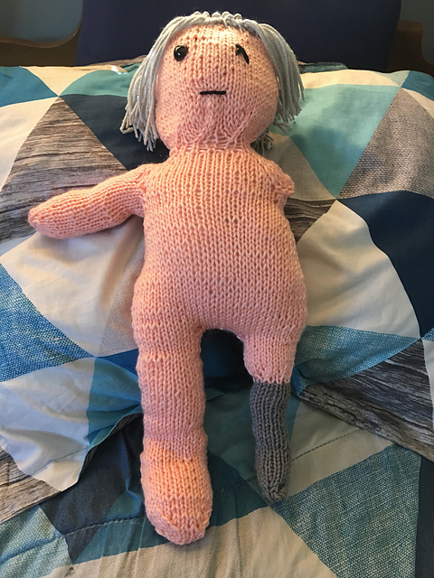 The finished doll of Akstar, sans clothing. He's got long silver hair pulled back in a pony tail, and is missing his left eye, arm, and leg. Where his missing leg would be is a peg leg. Akstar, NAKED!!